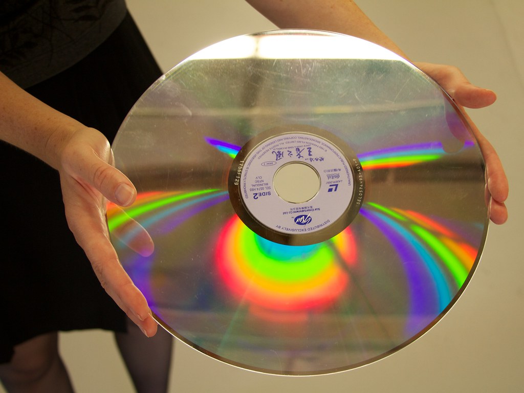 A person holding a laserdisc