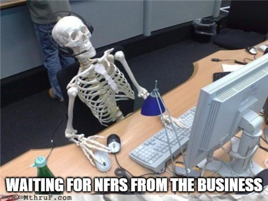 a bleached skeleton sitting at a desk in an office setting implying that death and decay have occurred while waiting. The caption reads "waiting for NFRs from the business
